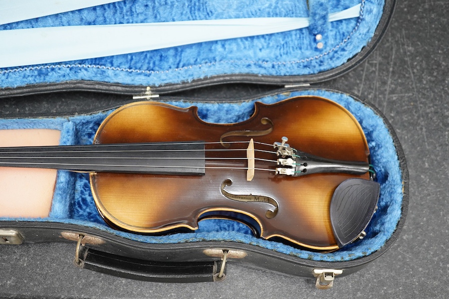 Three violins; a 3/4 Czech, a 1/2 size German and a 1/4 size Czech, all cased. Condition - fair to good